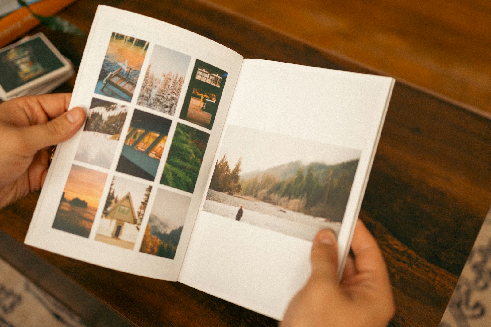 A person browsing an open photography book