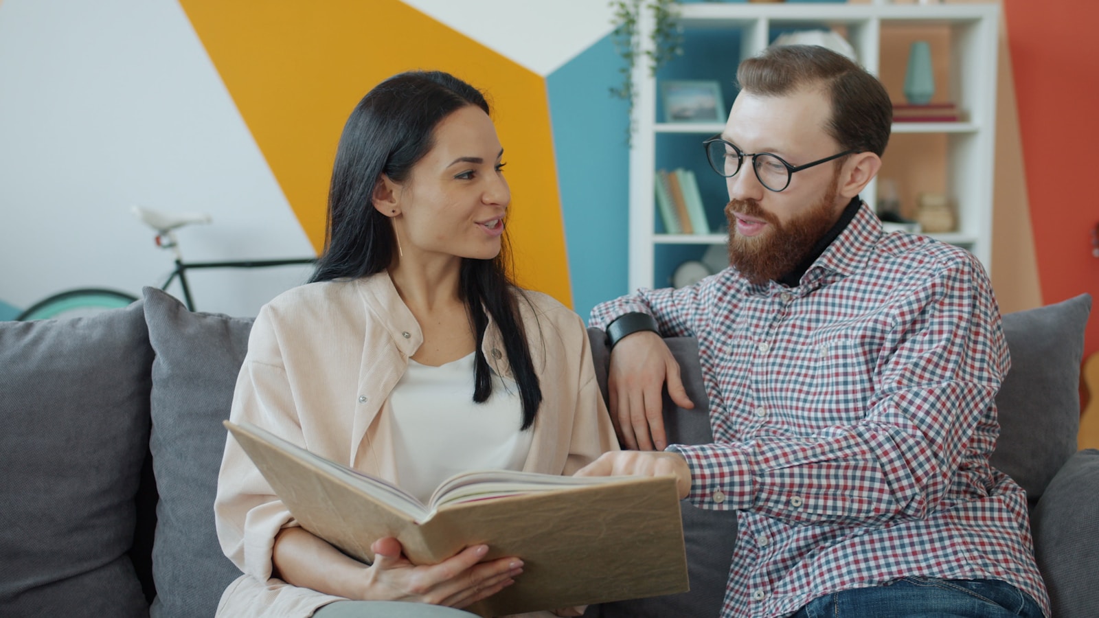 A couple looking through a photo album together