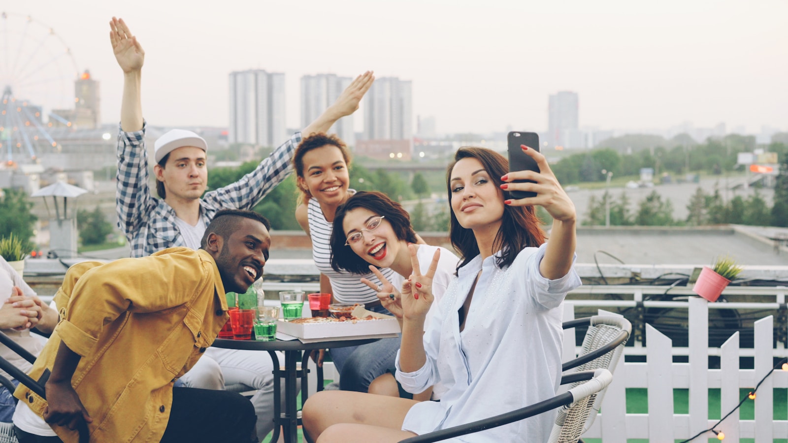 A group of friends posing together for a party selfie