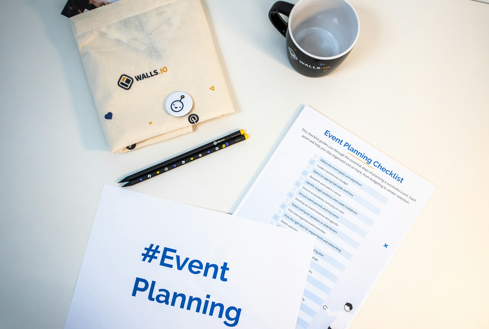 An event-planning checklist arranged on a desk
