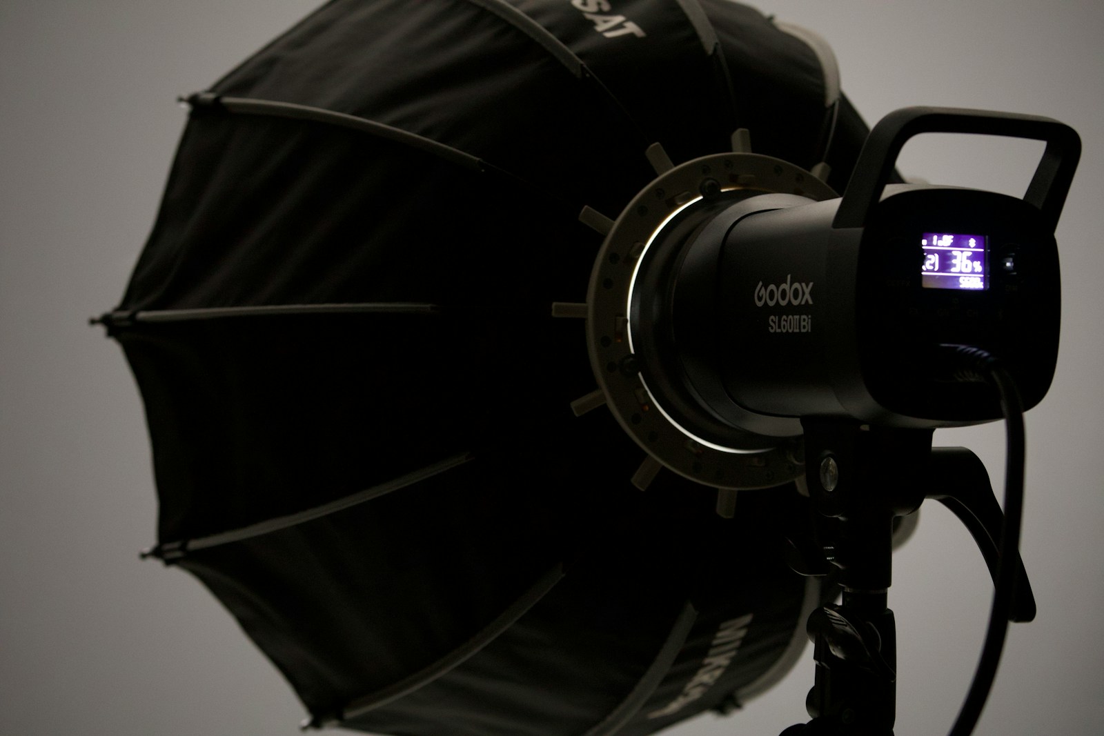 A professional photography light and umbrella modifier