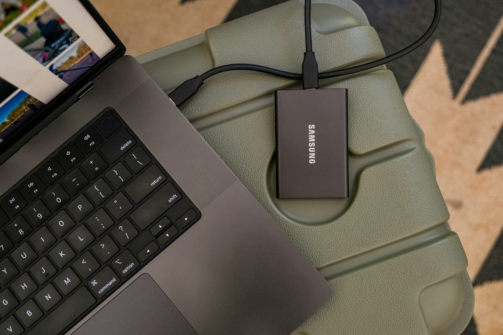 An external drive connected to a laptop for photo storage