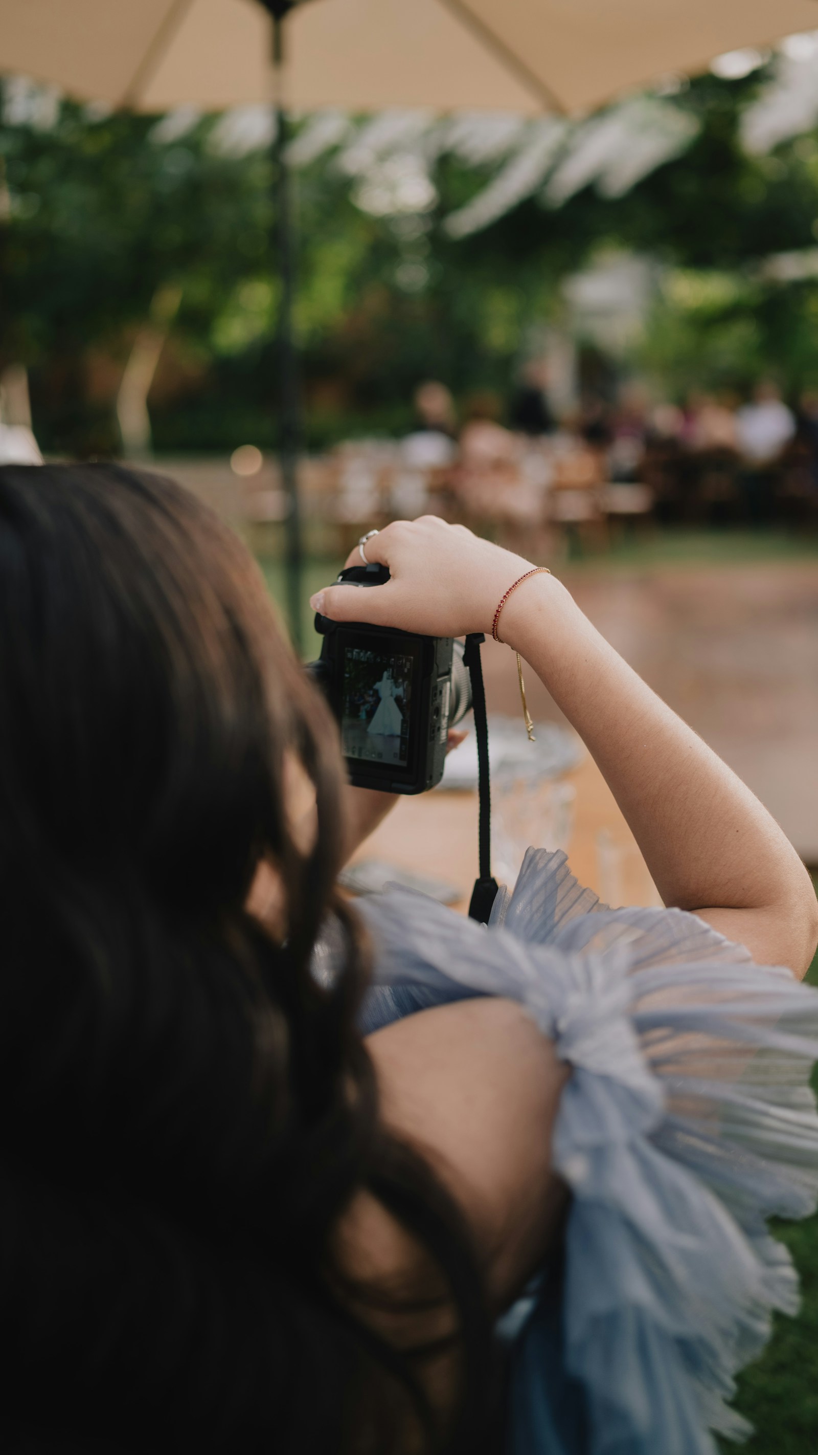 A wedding photographer capturing a bride